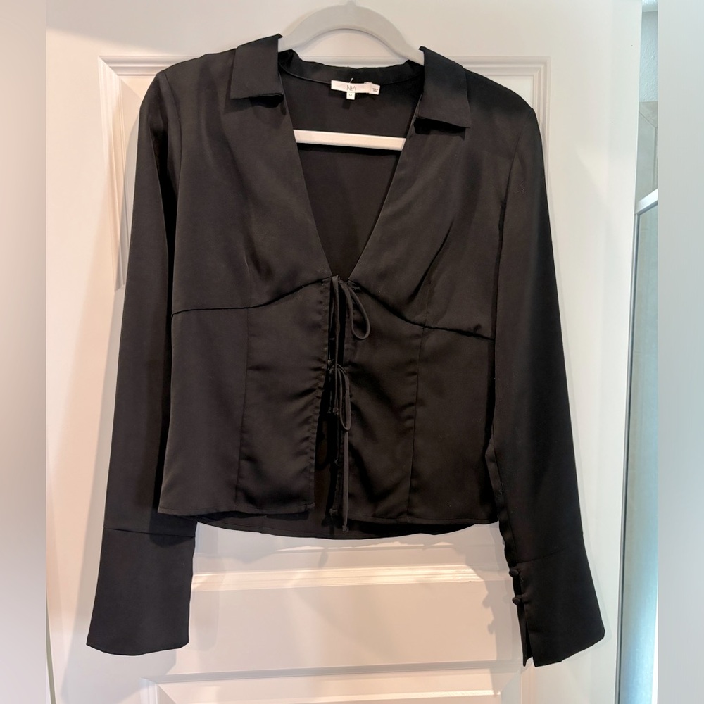 NIA black tie top. Size Medium but fits a small. Worn once. In perfect condition